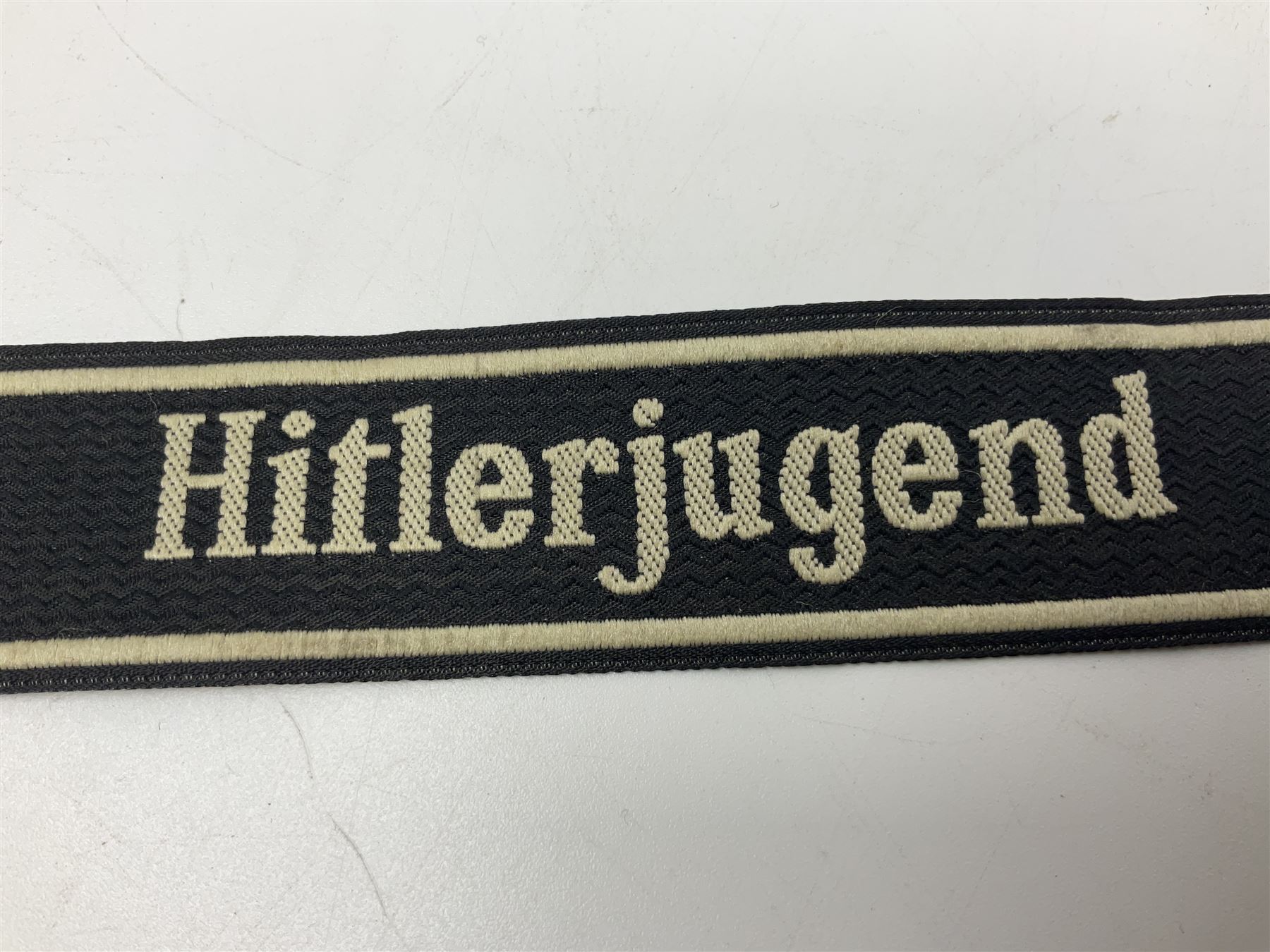 WW2 German Don Cossack epaulettes; and quantity of German insignia including SA Sports Badge for war wounded, Hitler Youth badge, Young Cossacks badge, Wound badge, Hitler Youth cuff title etc; in glass topped display box.