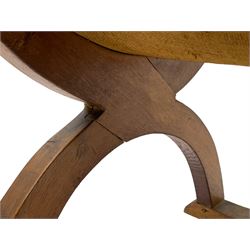 'Gnomeman' oak curved x-framed throne chair, sloped arched cresting rail carved with arcade, studded slung leather seat, the supports joined by sledge feet, rear upright carved with gnome signature, by Thomas Whittaker of Littlebeck