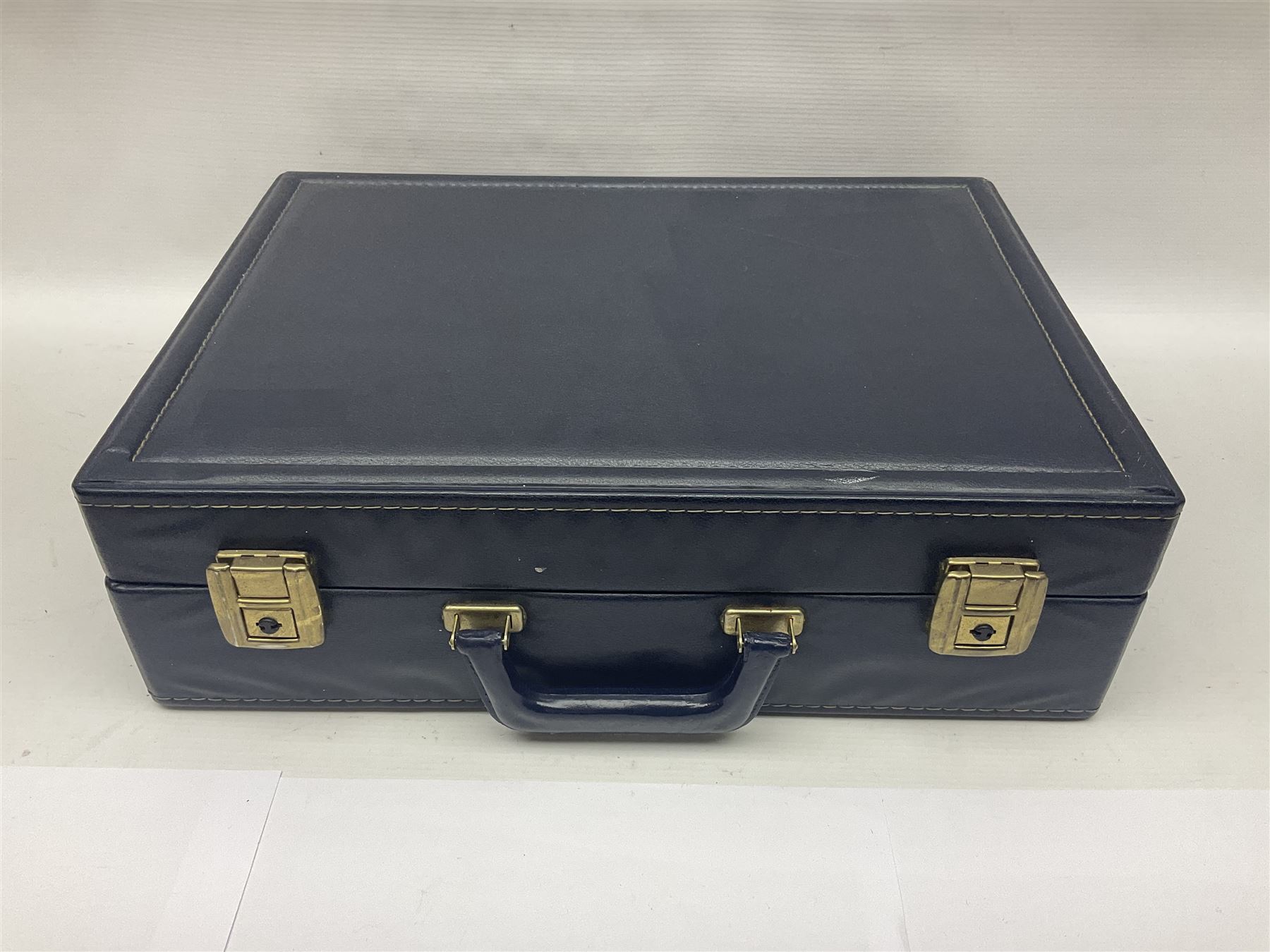 Bestecke Solingen canteen of gold plated cutlery for twelve place settings, including ladle, cake slice, fish servers, fish knives and forks, 108 pieces total, contained within a briefcase 