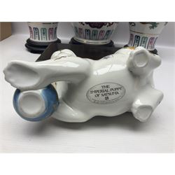 Franklin Mint Chinese style ceramics, comprising two vases, puppy and a planter, all on wooden stands