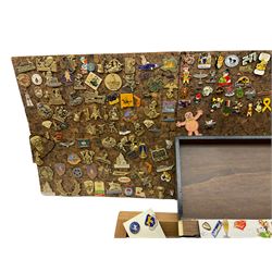 Very large quantity of metal and plastic pin badges, loose and mounted on cork panels, including many from the USA, some dated 1980s and 1990s