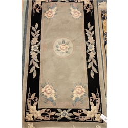  Chinese light blue ground rug, central floral medallion (140cm x 70cm) and two other similar rugs (3)  