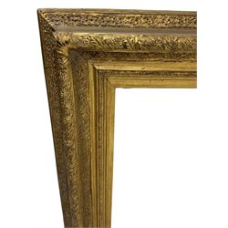 Victorian design gilt wall mirror, the frame decorated with moulded gold foliate patterns, with rectangular bevelled plate