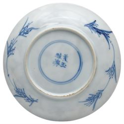 Chinese Kangxi period blue and white saucer, decorated with a hunter in a landscape, the boarder decorated with hunters and branches, D10cm