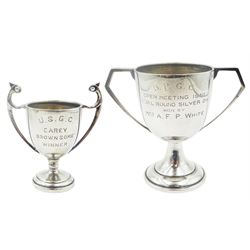 Two 20th century small Indian Colonial silver twin handled trophy cups, with engraved personal inscriptions, the largest example H9.5cm, stamped GK, the smaller marked for Warner Brothers, approximate total weight 4.4 ozt (137 grams)