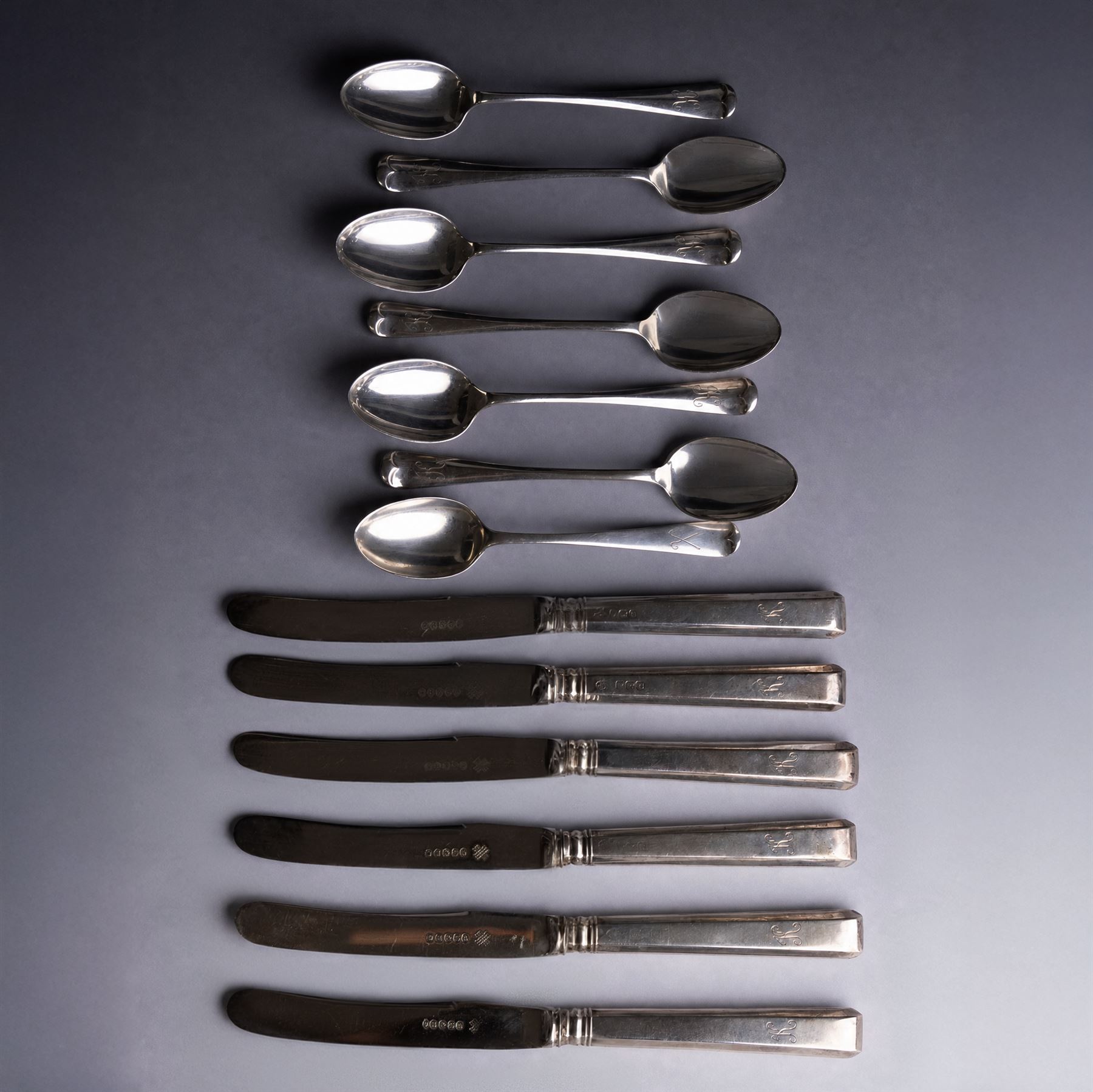 Set of six silver teaspoons with engraved initial K to finial, together with a set of six silver handled tea knives and one further silver teaspoon, all hallmarked