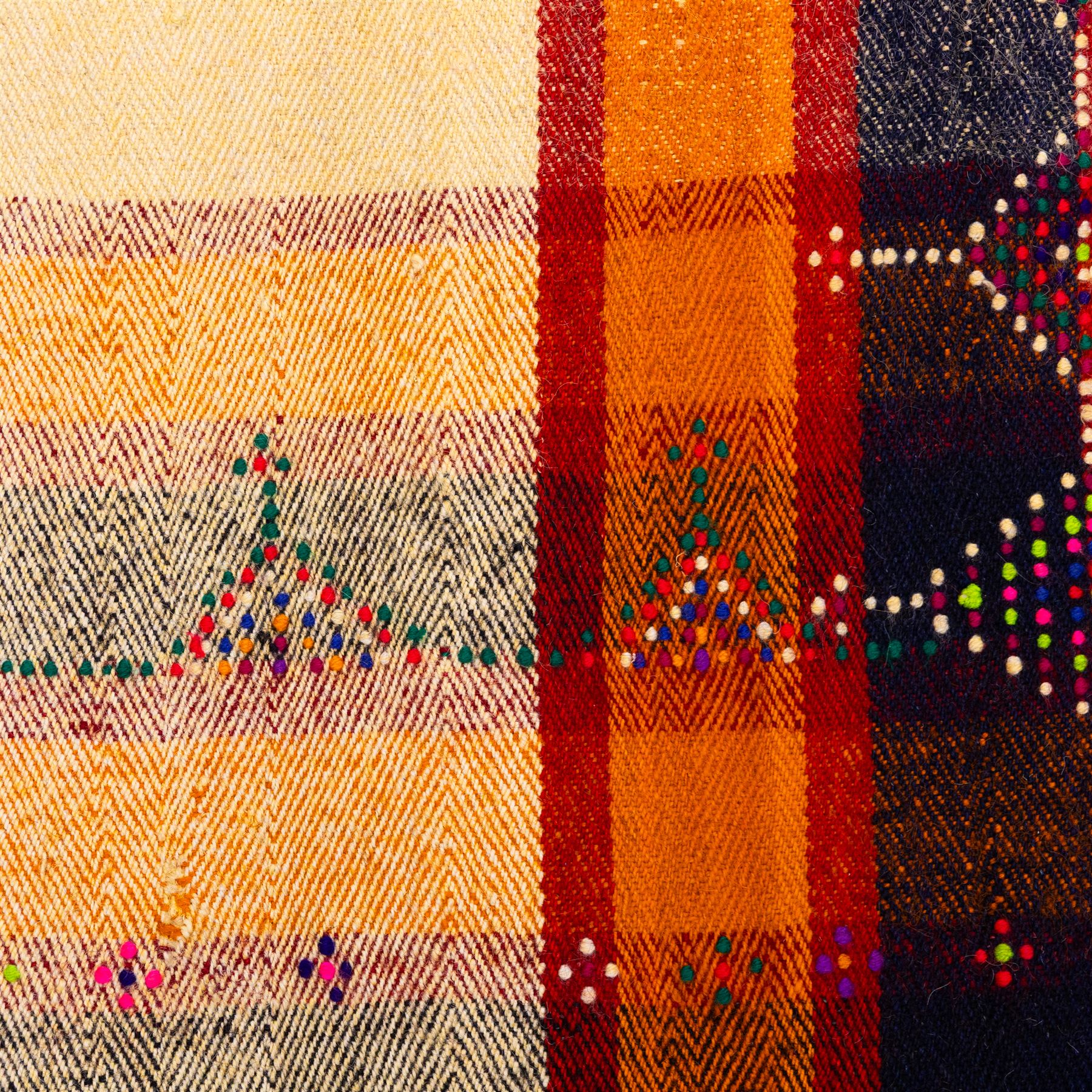 South West Persian Jajim kilim, central ivory field flanked by vertical bands of terracotta orange and dark brown decorated with simple geometric tribal motifs with raised wool pile details, edges finished with small coloured tassels 