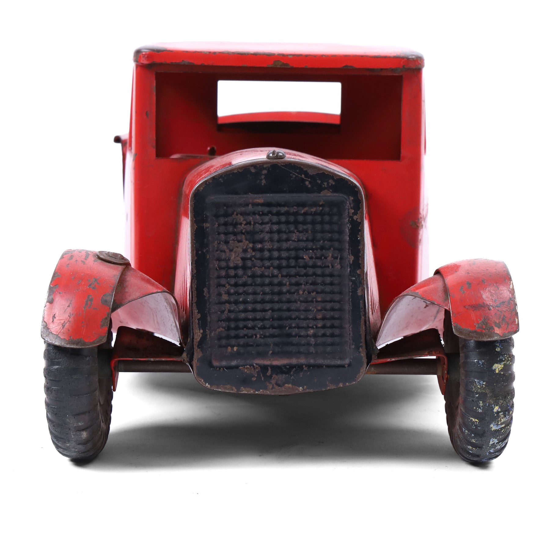 Tri-ang/Line Bros Ltd tin plate tipper truck, red body with black rubber wheels and red seat and steering wheel to interior, H49cm, L16cm