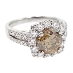 18ct white gold round brilliant cut fancy light brown diamond ring, with halo diamond surround and diamond set shoulders, stamped 750 18K, central diamond 2.00 carat, total white diamond weight 0.90ct