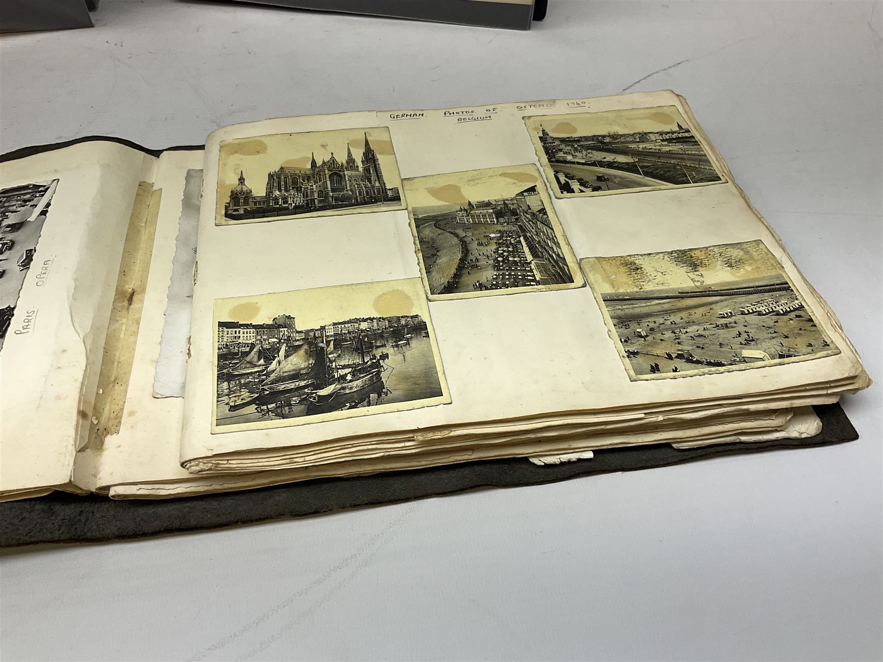 Postcards and postal history, including WWII period items, topographical postcards, military themed postcards including 'Daily Mail Battle Picture', 'War Bond Campaign Post Card' etc, housed in three ring binder albums, and an album containing various photos of men in military uniform dating from the late 1940s