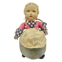 Farnell Alpha Toy soft toy of a Dutch girl, the pressed felt head with applied hair and painted features and overstuffed full length dress with apron and clogs; inoperative clockwork musical movement H31cm