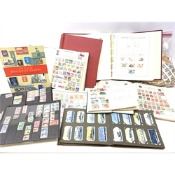  Collection of Queen Victoria and later Great British and World stamps in albums and loose including pre and post decimalization GB mint stamps, World stamps including a small number of Chinese stamps, France, Germany, Ghana, Hungary, India, Ireland, Italy, Jamaica etc and a part filled album of cigarette cards, in one box  