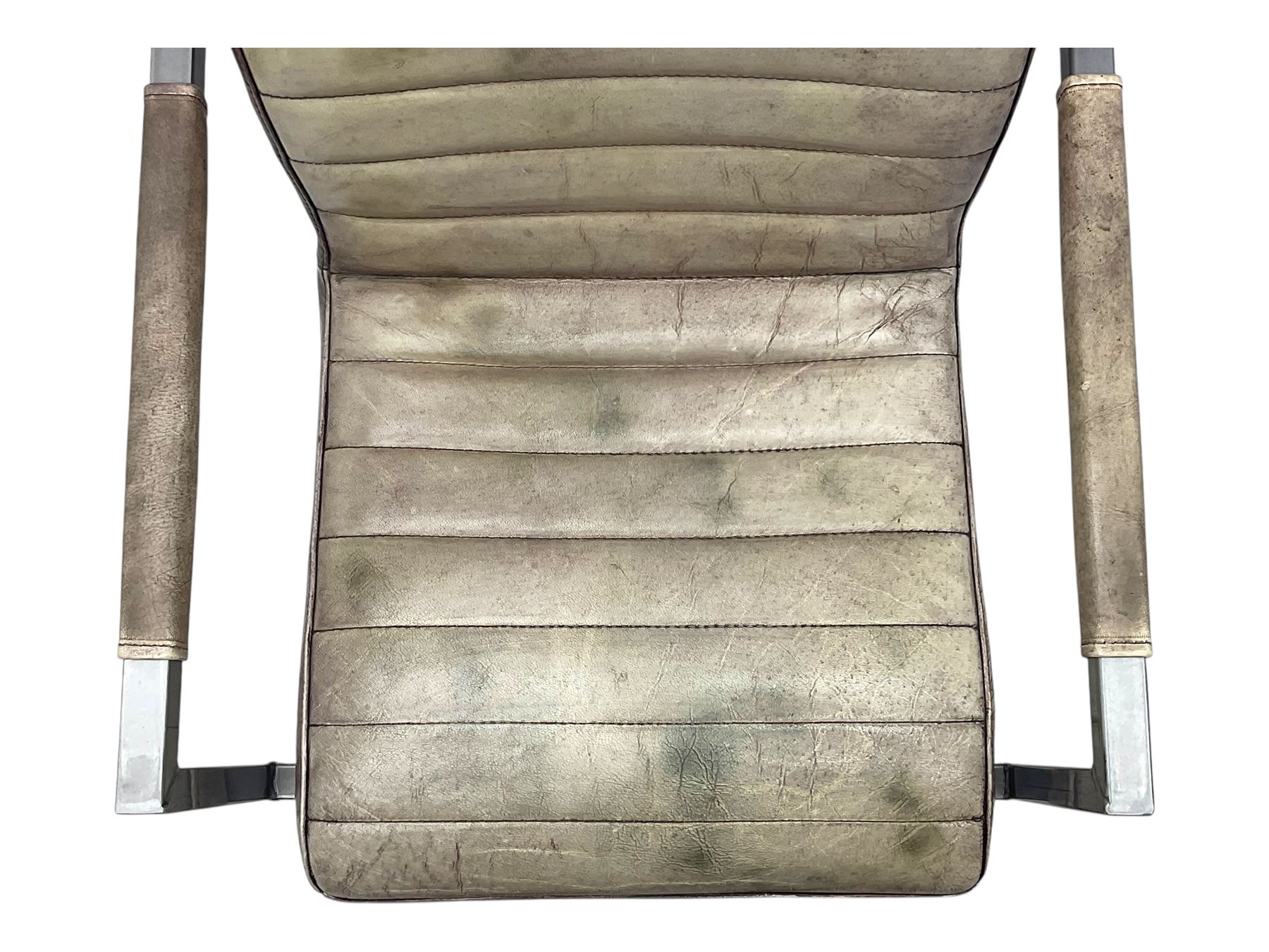 Pair of contemporary industrial style armchairs, each featuring a squared steel cantilever frame with upholstered arms, the seat and back finished in channel-stitched distressed tan faux leather