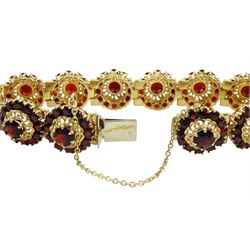 14ct gold garnet bracelet, twelve hinged links each with garnet clusters, stamped 585