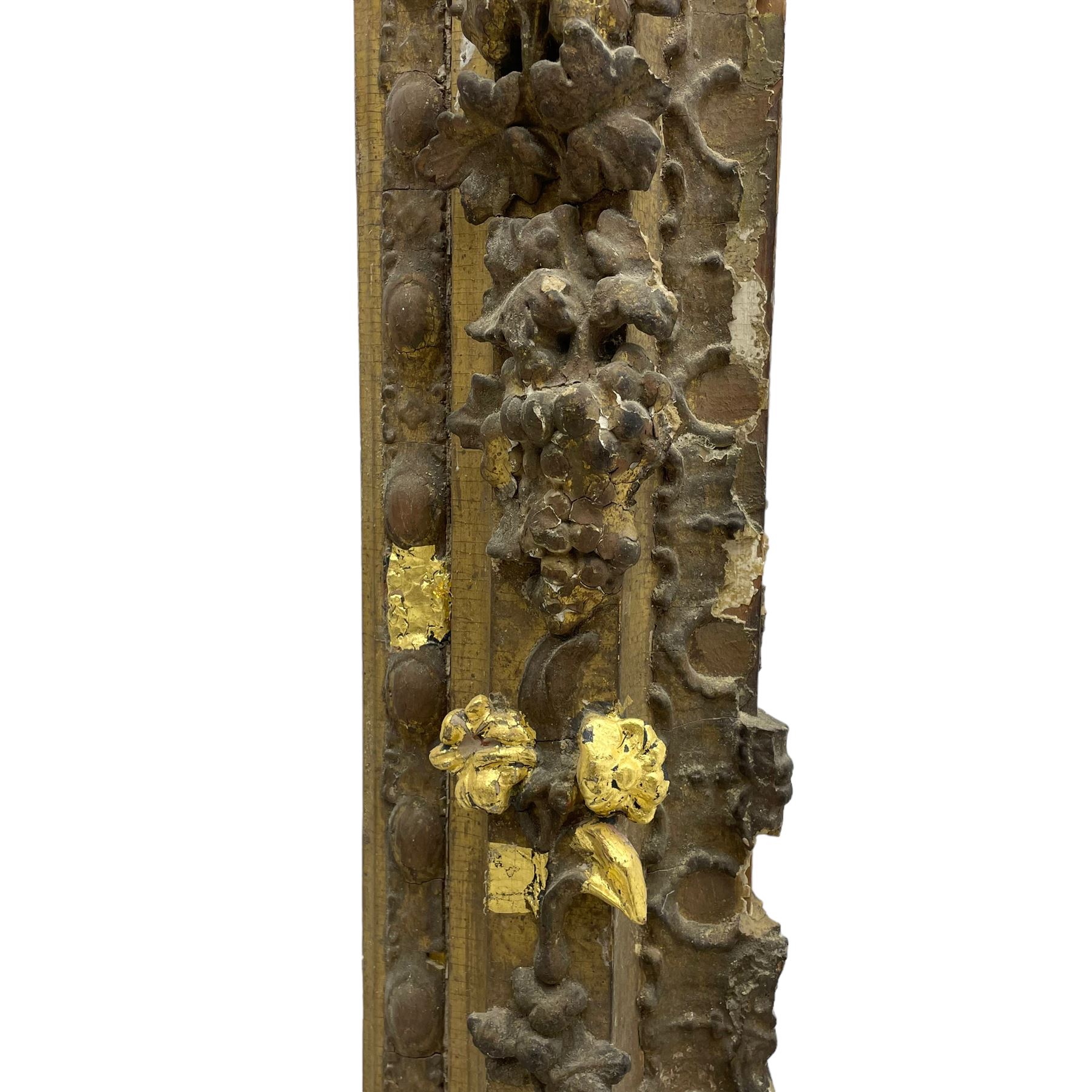 19th century giltwood and gesso moulded picture or mirror frame, the arched cresting rail mounted by central cartouche decorated with foliate scrolls and fruit, the outer frame decorated with scalloped edge and shell mouldings, trailing foliage with flower head and fruit to the central band, egg and dart moulded inner slip