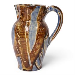 David Garland (b.1941) jug, decorated in a blue and brown glaze, with leaves and abstract patterns, H27cm