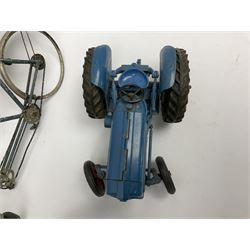 Chad Valley clockwork Fordson Major Tractor, a group of play worn Britains and other lead and metal farm animals, figures and accessories including a kennel, haystacks, dovecote, cows, sheep etc, together with a diecast model of a Tandem Bike L31cm