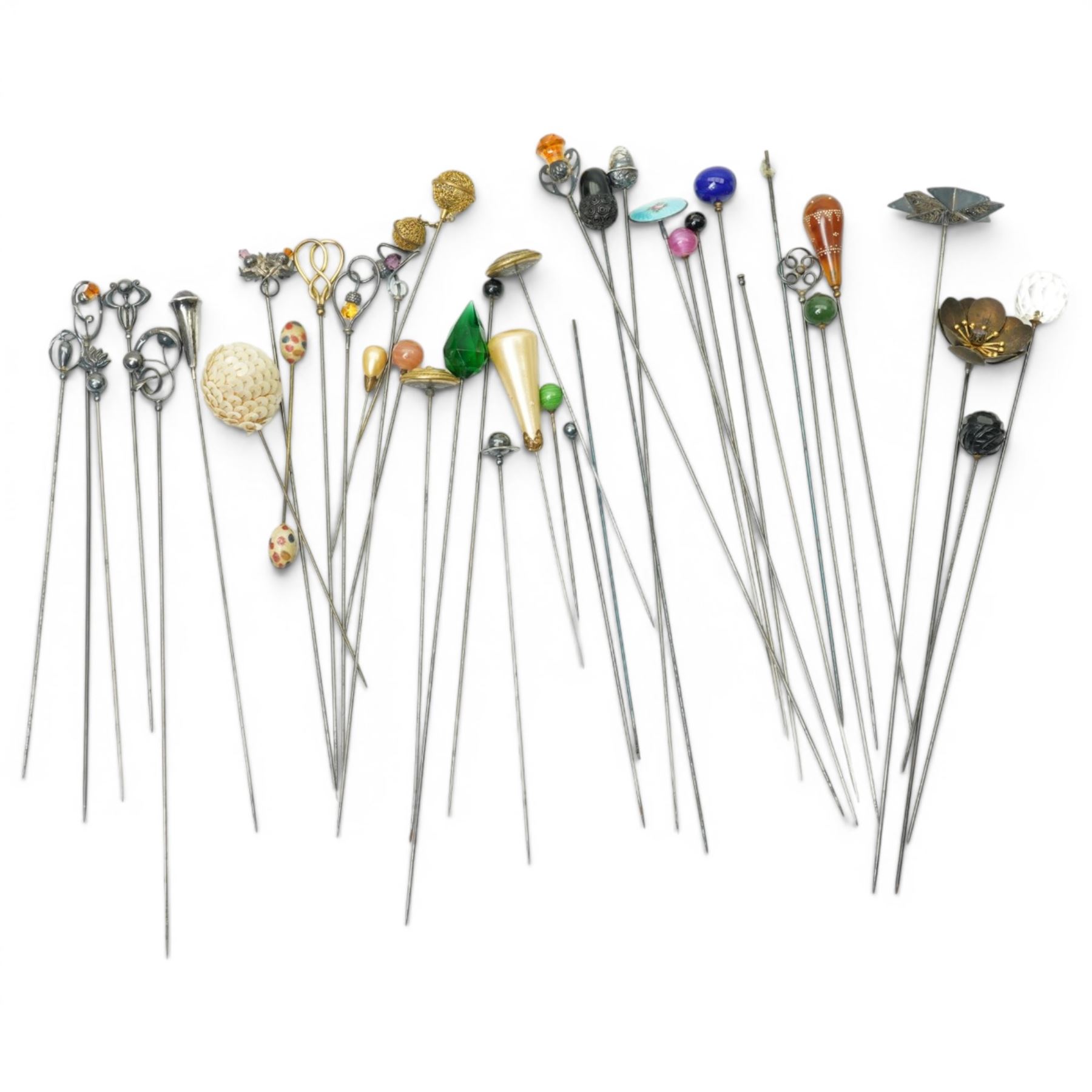 Collection of early 20th century and later hat pins including six silver mounted examples by Charles Horner, pique work, faceted class, jet acorn, filigree etc