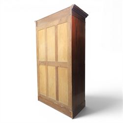 Quality Edwardian mahogany double wardrobe, featuring bevelled mirrored and panelled door with applied moulded detail, internal brass rail hanging and shoe rails