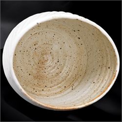 Joanna Constantinidis (1927-2000); studio pottery stoneware vase with fluted body, in a white glaze with brown speckles, impressed C mark to base, H20cm 