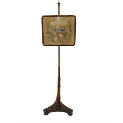 Victorian mahogany pole screen, with needlework panel depicting the Prince of Wales feathers and floral garland, vasiform pole with lappet decoration, on a concaved triangular platform with compressed bun feet