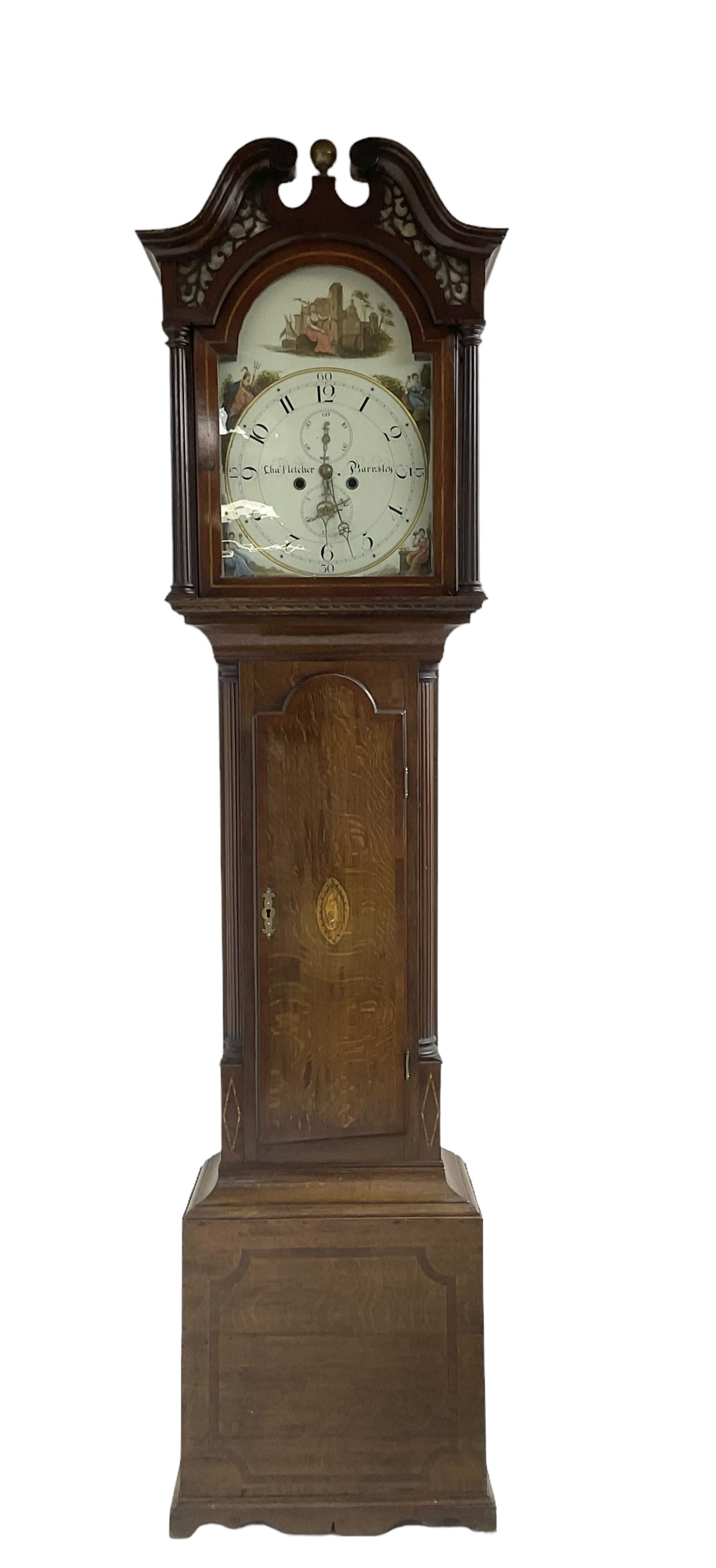 Charles Fletcher of Barnsley - Oak and Mahogany 8-day longcase clock, c 1830, with a swans neck pediment, silk backed open fret work beneath and a break arch hood door, flanked by reeded pilasters with wooden capitals, trunk with reeded quarter columns and a break arch topped door, plinth with inlaid banding on a shaped base, painted dial with Arabic numerals, seconds and date dials, stamped brass hands and painted depictions of the four seasons to the spandrels, dial pinned via a false plate to a rack striking movement with a recoil anchor escapement, striking the hours on a cast bell. With weights and pendulum.