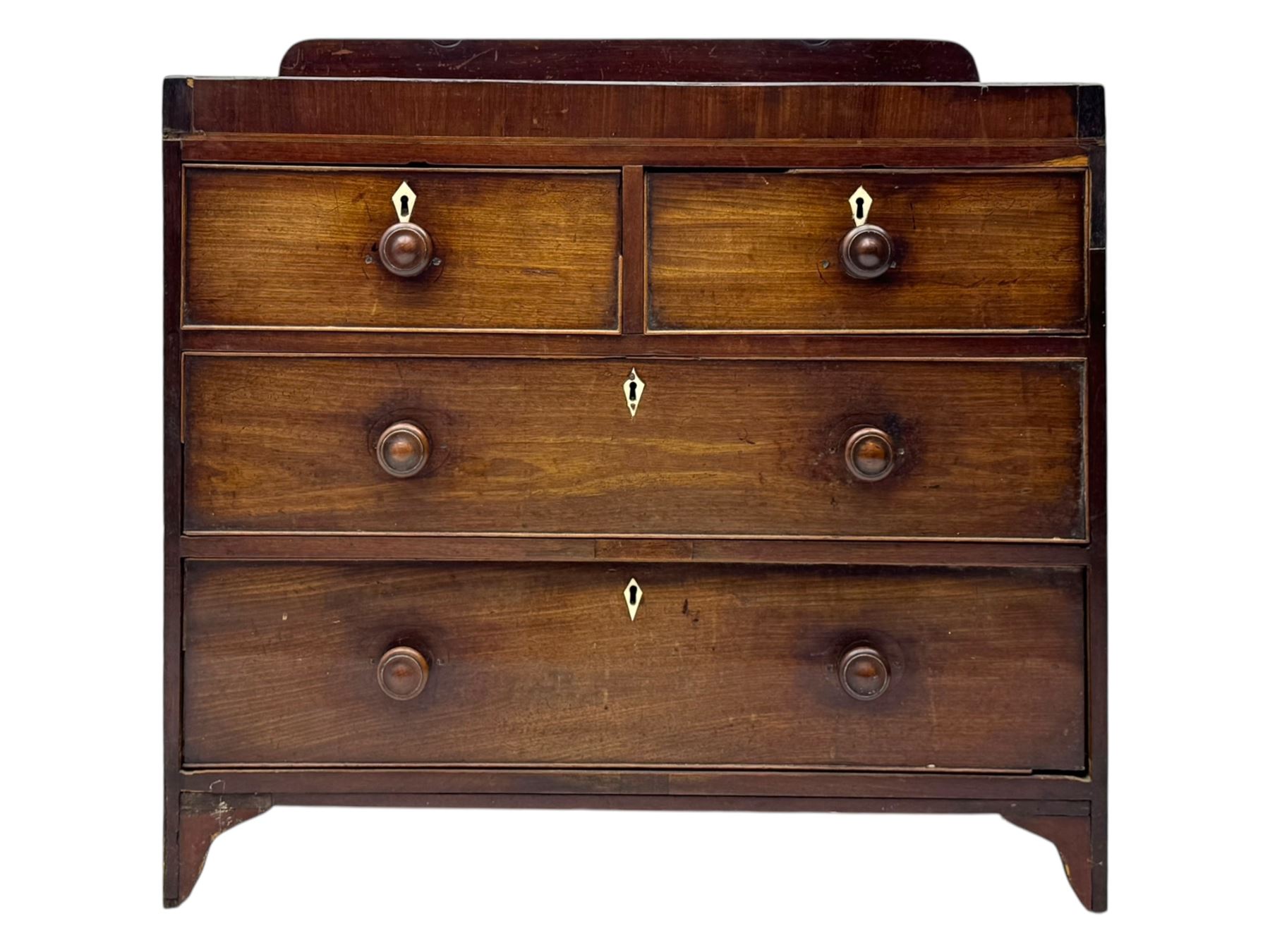 19th century mahogany chest, rectangular top with raised gallery back, fitted with two short and two long cockbeaded drawers, each with bone escutcheon, on shaped bracket feet