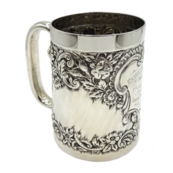  Silver christening mug embossed floral decoration with later engraved cartouche by E S Barnsley & Co, Birmingham 1890, approx 6.5oz   
