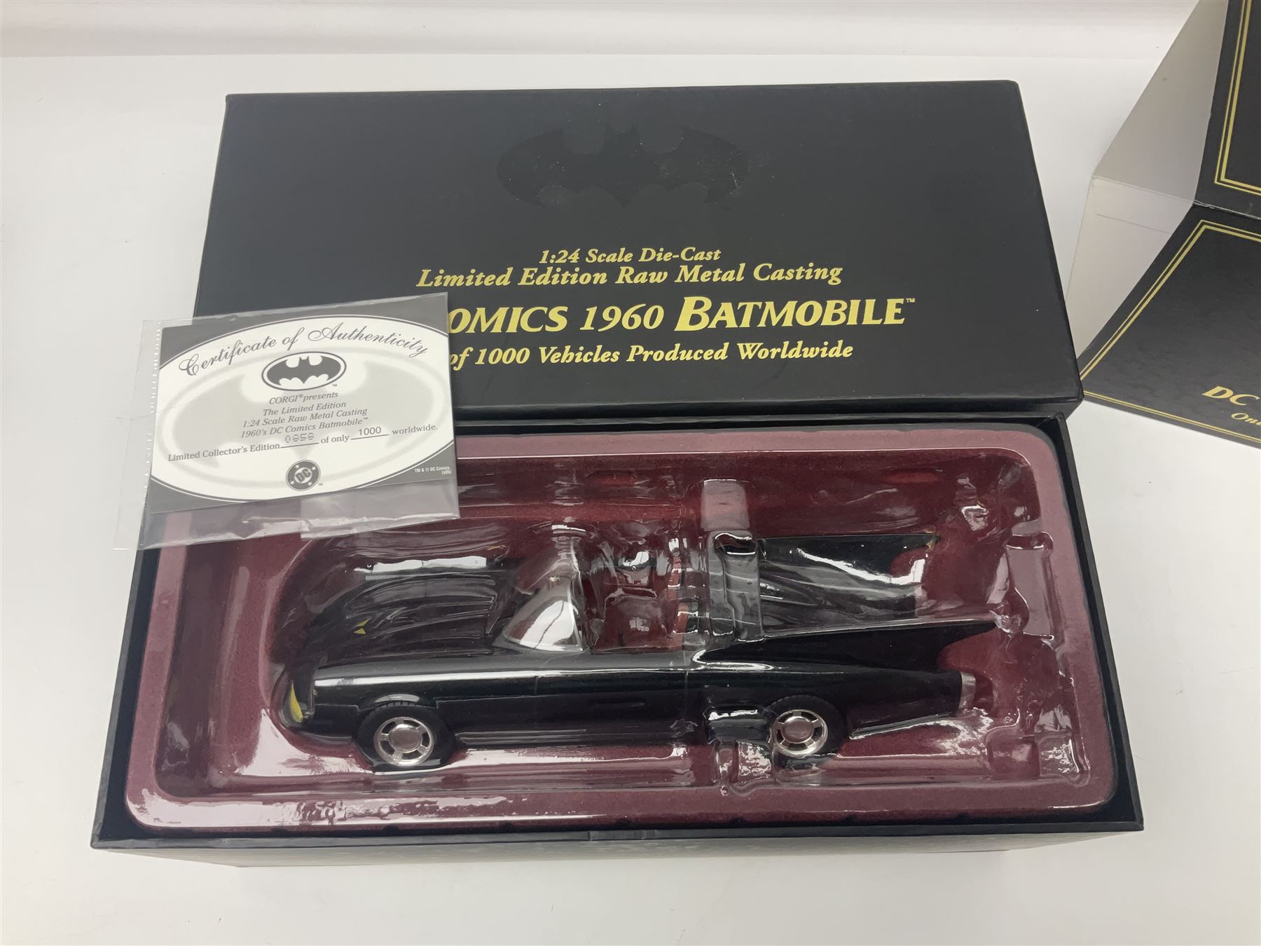 Two Corgi DC Comics die-cast Batmobiles comprising 1:18 scale die-cast Limited Edition Pre-Production Raw Metal Casting 1940 Batmobile Roadster no. 184/300, and 1:24 scale die-cast Limited Edition Raw Metal Casting 1960 Batmobile no. 858/1000, both with original boxes and certificates of authenticity 