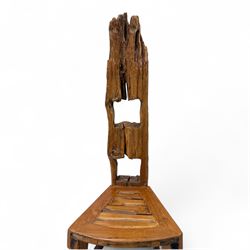 20th century driftwood sculptural hall chair, solid triangular seat over shaped apron, high ladder back formed from weathered and irregular timber, raised on curved legs united by H-stretcher
