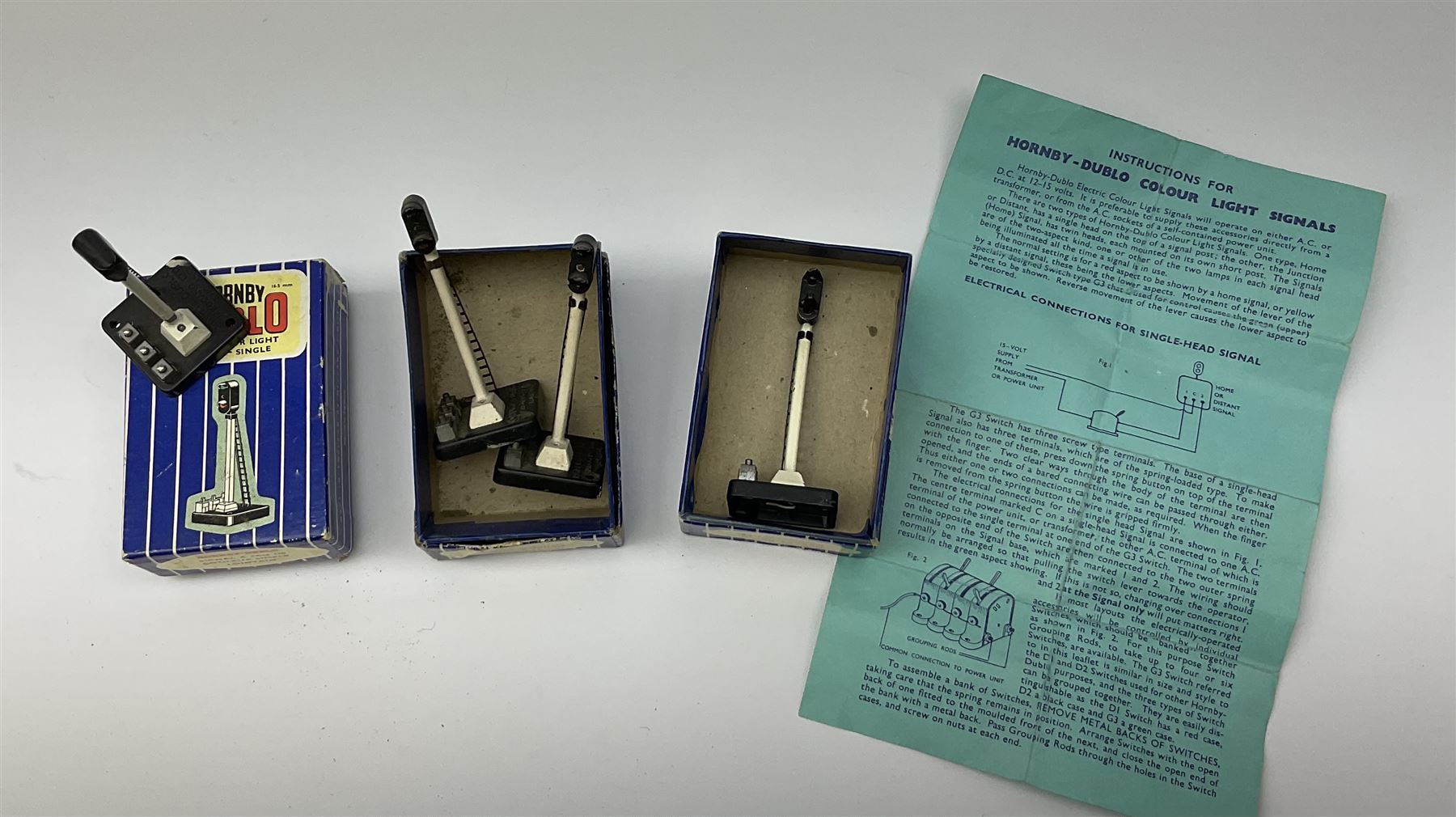 Hornby Dublo - twelve electric semaphore signals comprising four ED1 Single Arm; two ED2 Double Arm; one ED3 Junction Signal Upper Quadrant; one 5045 Colour Light Signal - Single (Home); two ES6 Colour Light Signal -Single (Distant); and two 5047 Colour Light Signal - Junction (Home); all boxed (12)
