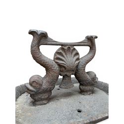 Victorian cast iron boot scraper, supported by two dolphins with central shell motif