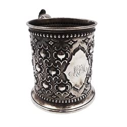 Victorian silver christening mug, with repousse and chased scroll and bead decoration, lozenge shaped cartouche engraved with monogrammed initials and acanthus capped C scroll handle, hallmarked Robert Hennell III, London 1861, H9.3cm