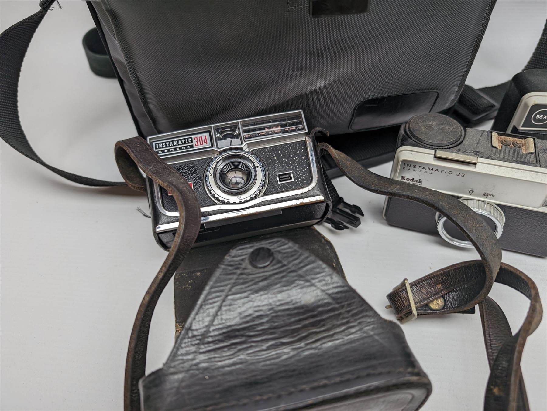 Canon EOS 650 camera, serial no 2122736, in carry case with some accessories, together with an Olympus XA2 camera and ten Kodak Instamatic cameras and two similar