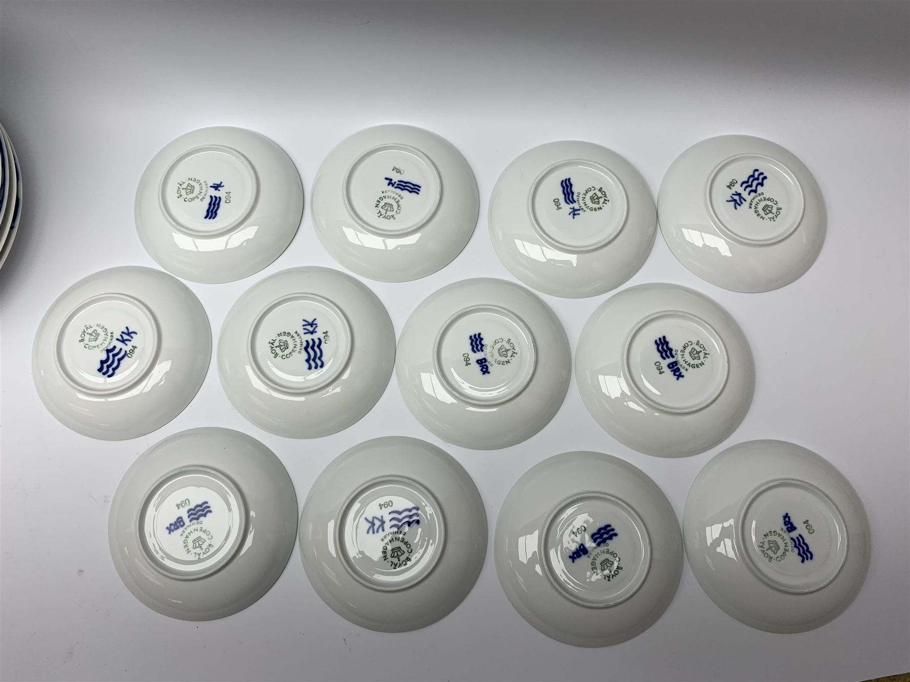 Royal Copenhagen tea and dinner service for twelve place settings, decorated in the Mega Blue Fluted pattern, pattern number 622, comprising dinner plates, salad plates, bowls with pierced rim, smaller bowls, tea cups, and saucers, dinner plates D27.5cm, salad plates D22cm