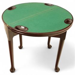 20th-century Georgian Revival style double fold-over card table, the first hinged circular top with polished mahogany surface above a second hinged circular top revealing a green baize playing surface with four counter-wells, underneath with a recessed compartment with and  chip and dice wells, the apron with fitted lock and key, raised on slender straight legs with pad feet 