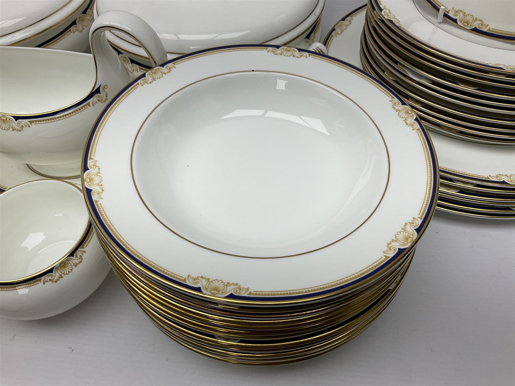 Wedgwood Cavendish pattern dinner service for twelve, comprising dinner plates, side plates, bowls, soup bowls, two tureens, saucer boat and sauce, together with matching part coffee service (82) 
