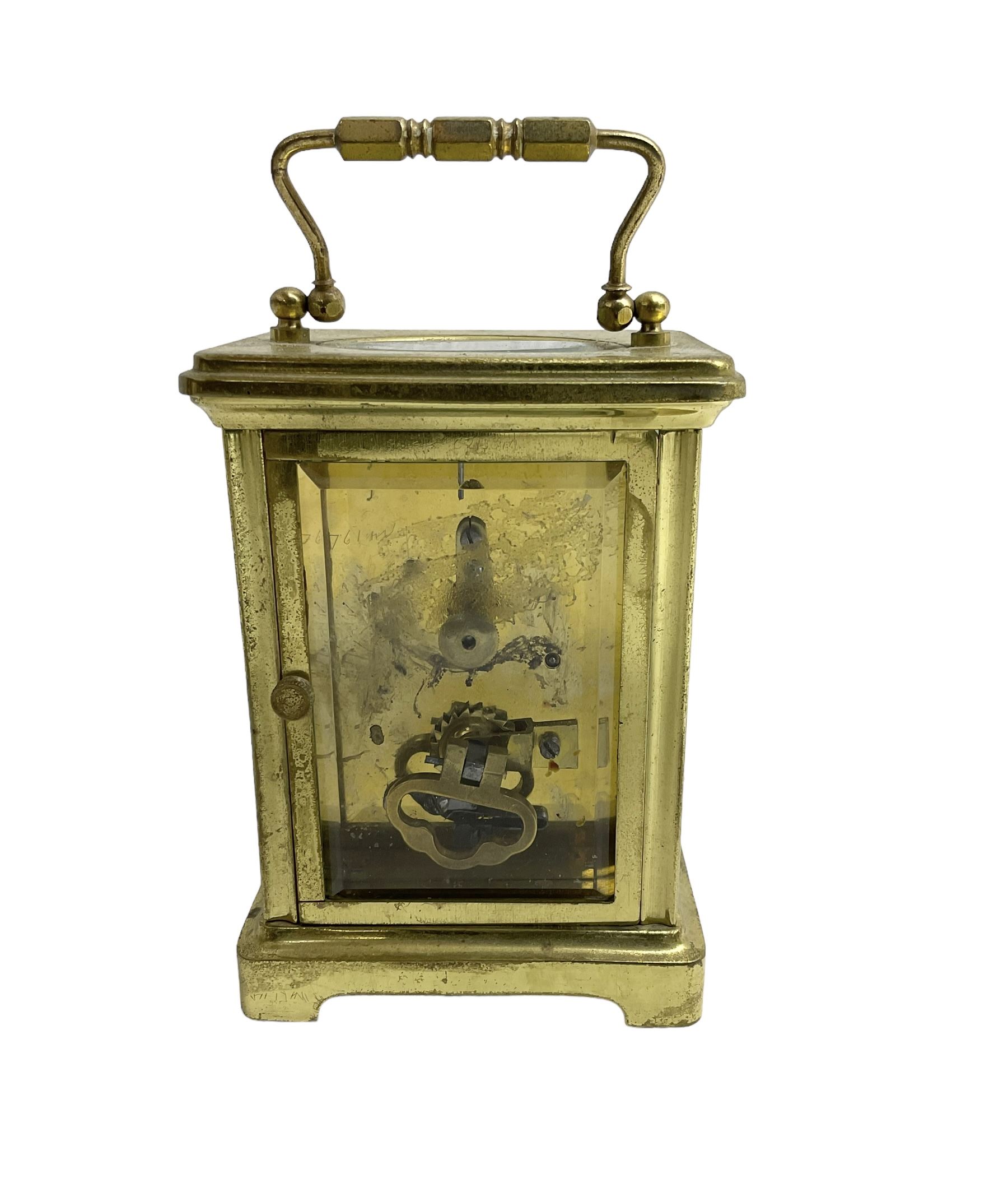 French - 20th century timepiece carriage clock, in a corniche case with carrying handle, enamel dial with Roman numerals, minute track, spade hands and retailers name “Mallory, Bath”, cylinder platform escapement, wound and set from the rear.