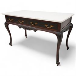 Late Victorian mahogany washstand, rectangular pale granite top over two drawers, the drawer front decorated with blind fretwork and ornate gilt cast metal handles, shaped apron carved with curled foliage, on acanthus carved cabriole supports 
