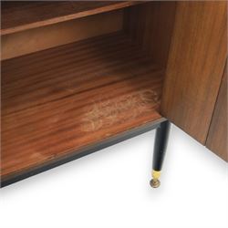 G Plan - ‘Librenza’ tola wood sideboard, the rectangular top above two cupboards to either side and three graduated central drawers, the drawer and door fronts veneered in figured tola wood with brass handles, standing on splayed tapering legs