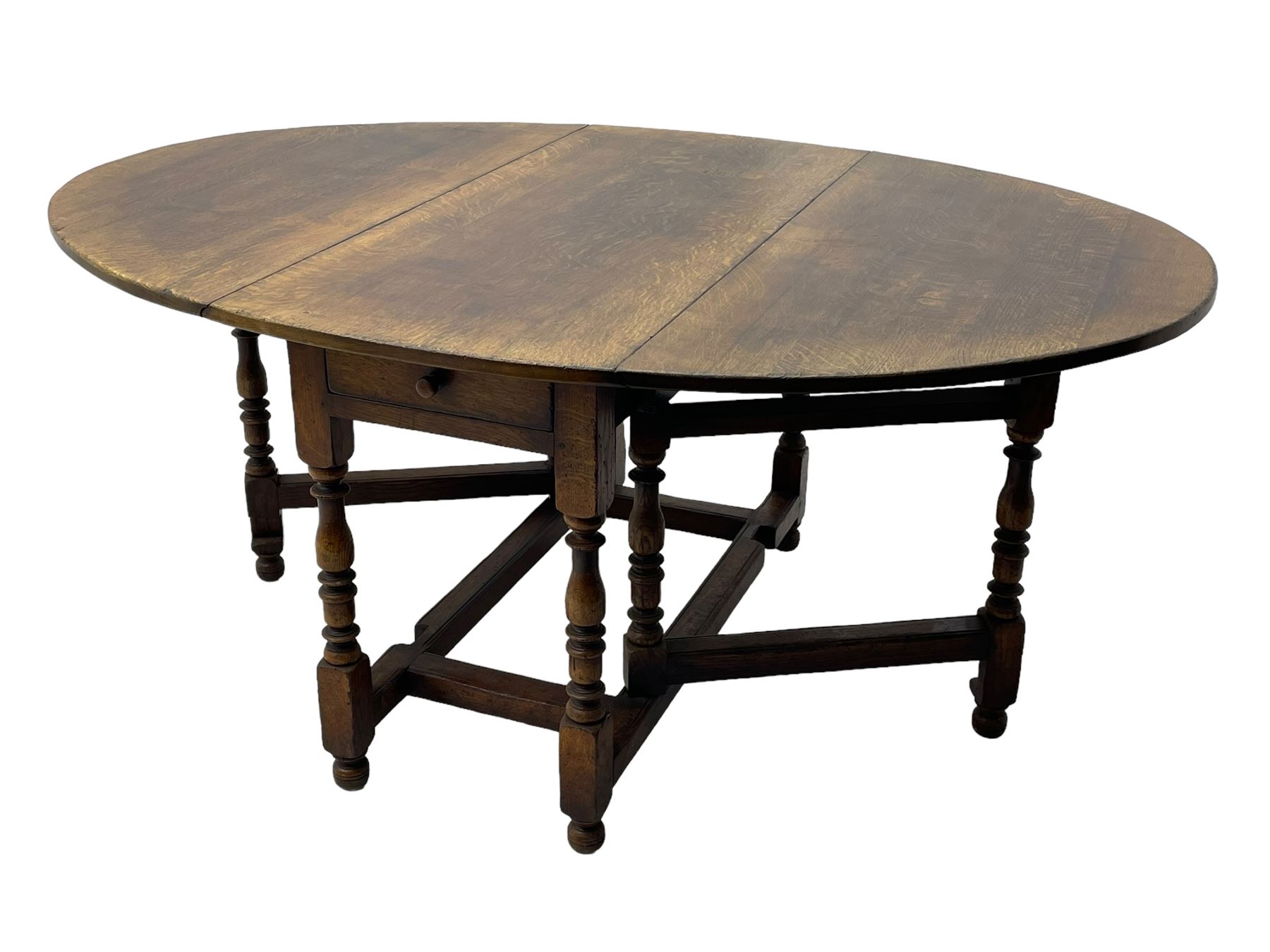 19th century oak dining table, oval drop-leaf top on gate-leg action base, turned supports united by turned stretchers, fitted with single end drawer