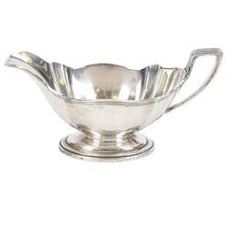 American silver sauce boat, with shaped rim and engraved to body with monogram, upon oval stepped foot, stamped Sterling and with maker's marks for Gorham, H9.5cm