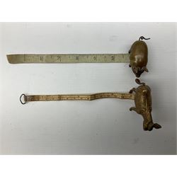 Two 19th century novelty tape measures, one the form of a donkey and the other in the form of a pig, both housing a printed tape in ins. and cm, and winding mechanism from the tail 