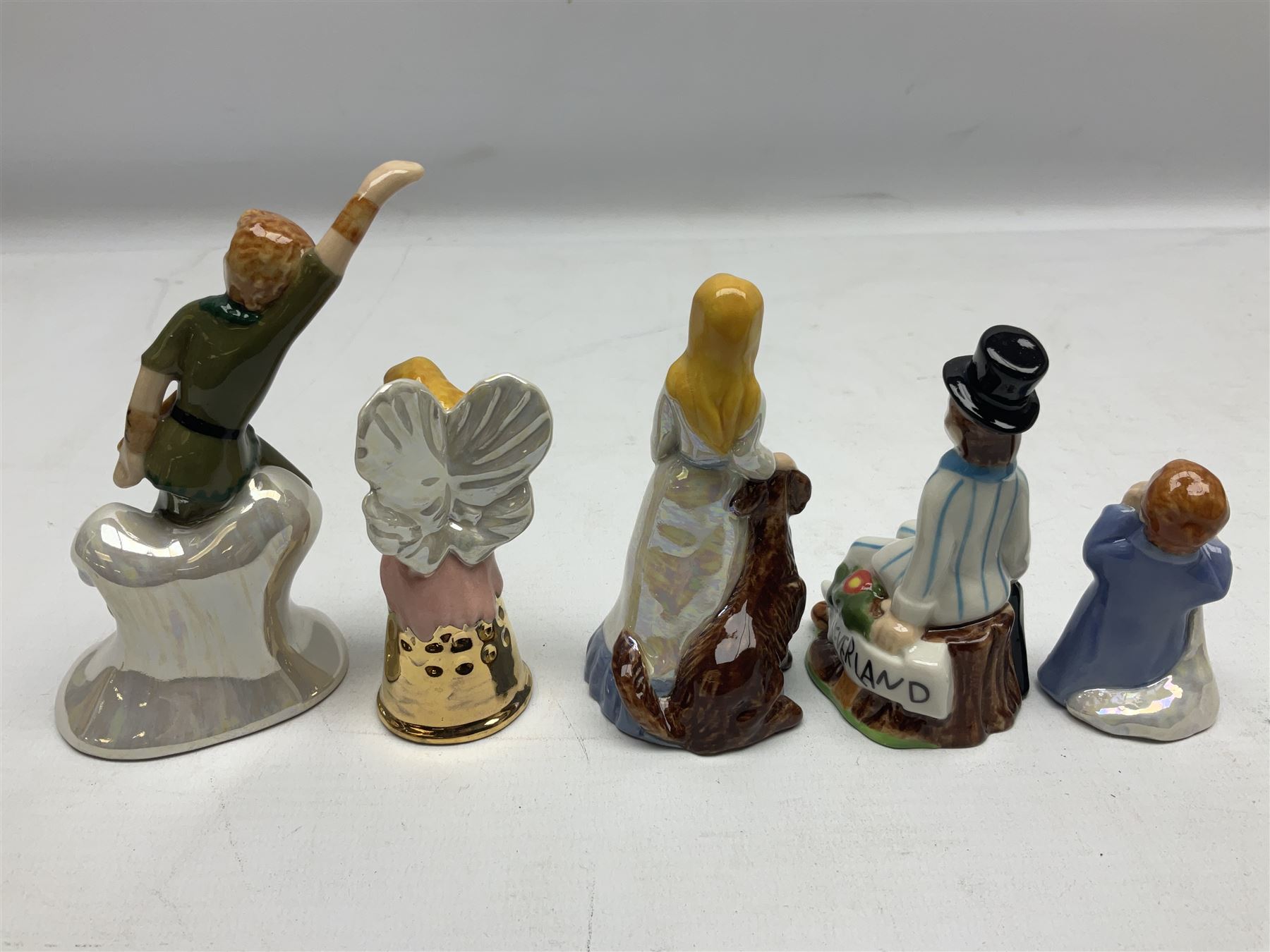 Twelve Wade Collectors Club Figures, comprising six Wind in the Willows figures; Rattie, Mole, Toad, Badger, Weasel and Rattie and Mole on the Water, Six Peter Pan figures; Captain Hook, Peter Pan, Wendy, John, Michael and Tinkerbell  