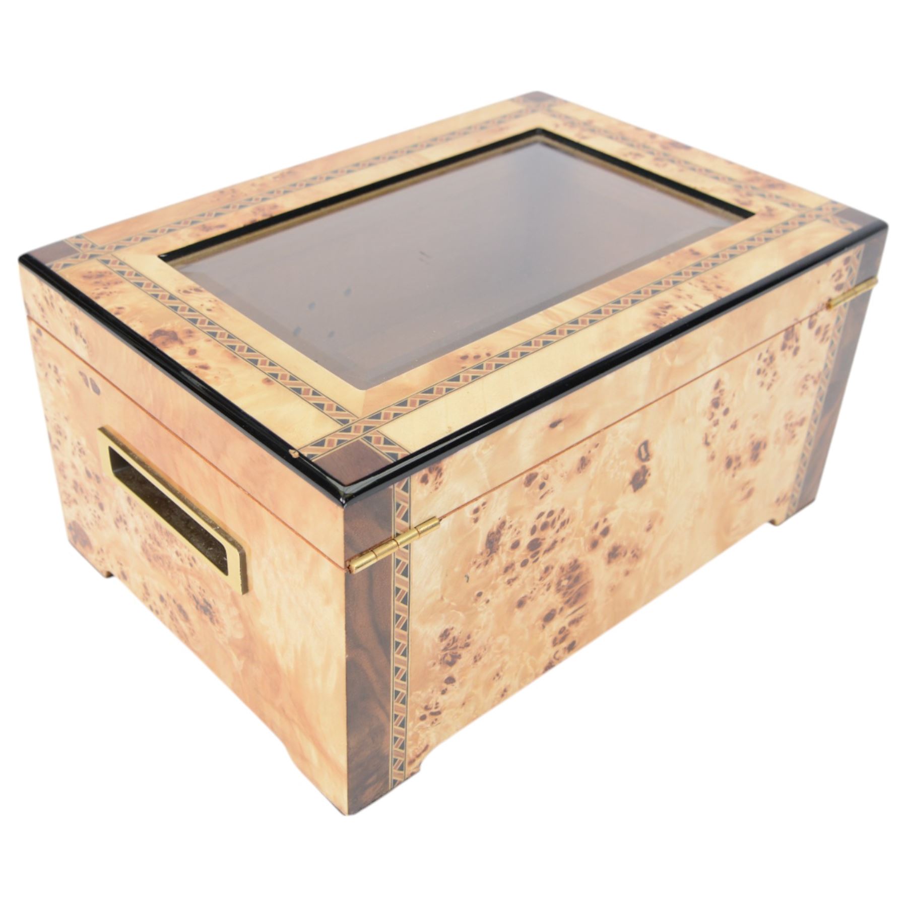 Cigar humidor, of high gloss birdseye maple veneer, the lid with central glass panel, brass handled draw to the front, fitted with a hygrometer, H18cm D24cm 