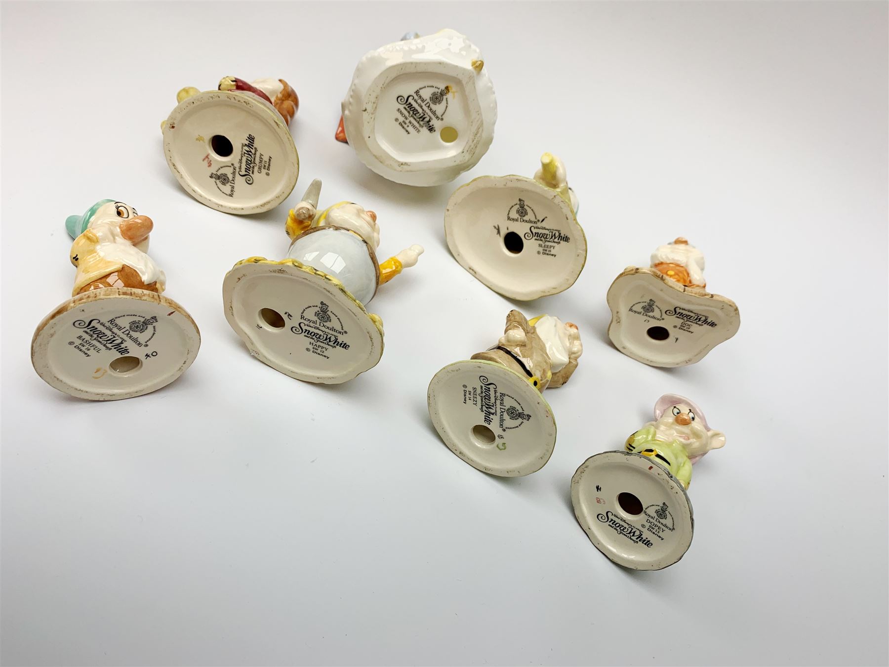 Royal Doulton Snow White and the Seven Dwarfs figurines, each with box. (8). 