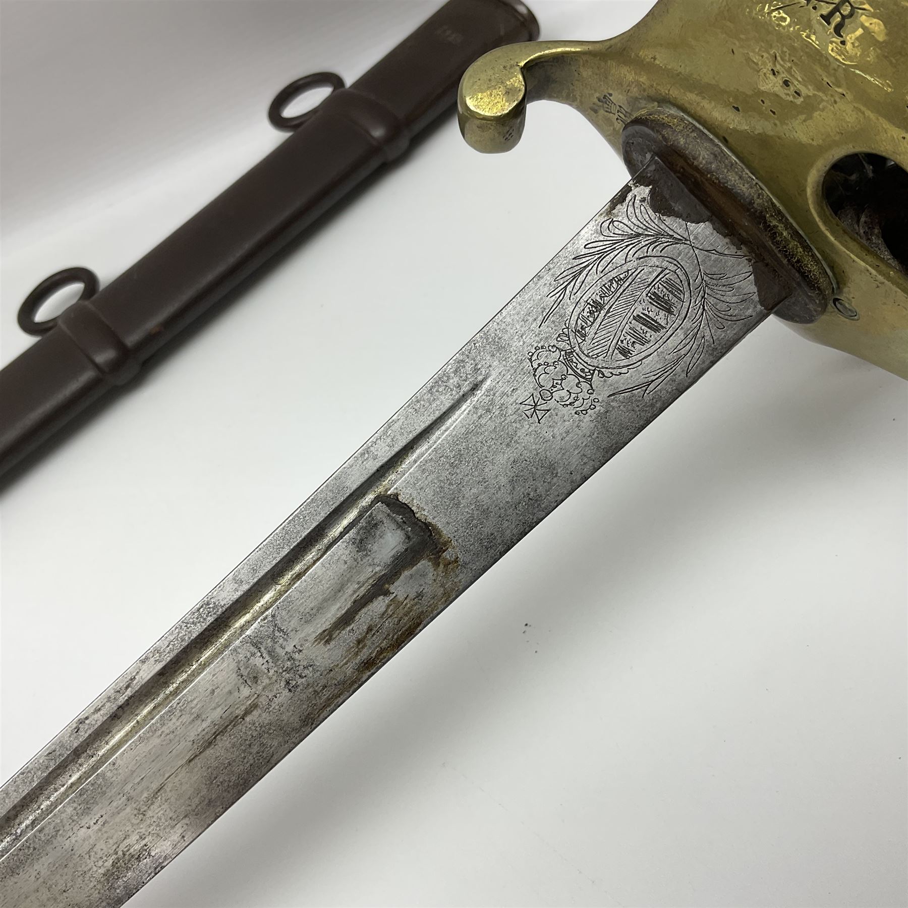 19th Century German (Saxony) Cavalry Sword, the 90.5cm single edge curved steel blade with narrow fuller to the back edge at each side, engraved with a crowned AR monogram and coat of arms, stamped with crowned AR, the back edge engraved C.v Keller im Solingen 1862, the brass half basket hilt with three flat curved bars, applied badge missing, marked G.R. 4, with ribbed leather covered grip and leather finger strap; in steel scabbard with two fixed suspension rings to one side and stamped G.R. II 118; L109.5cm overall