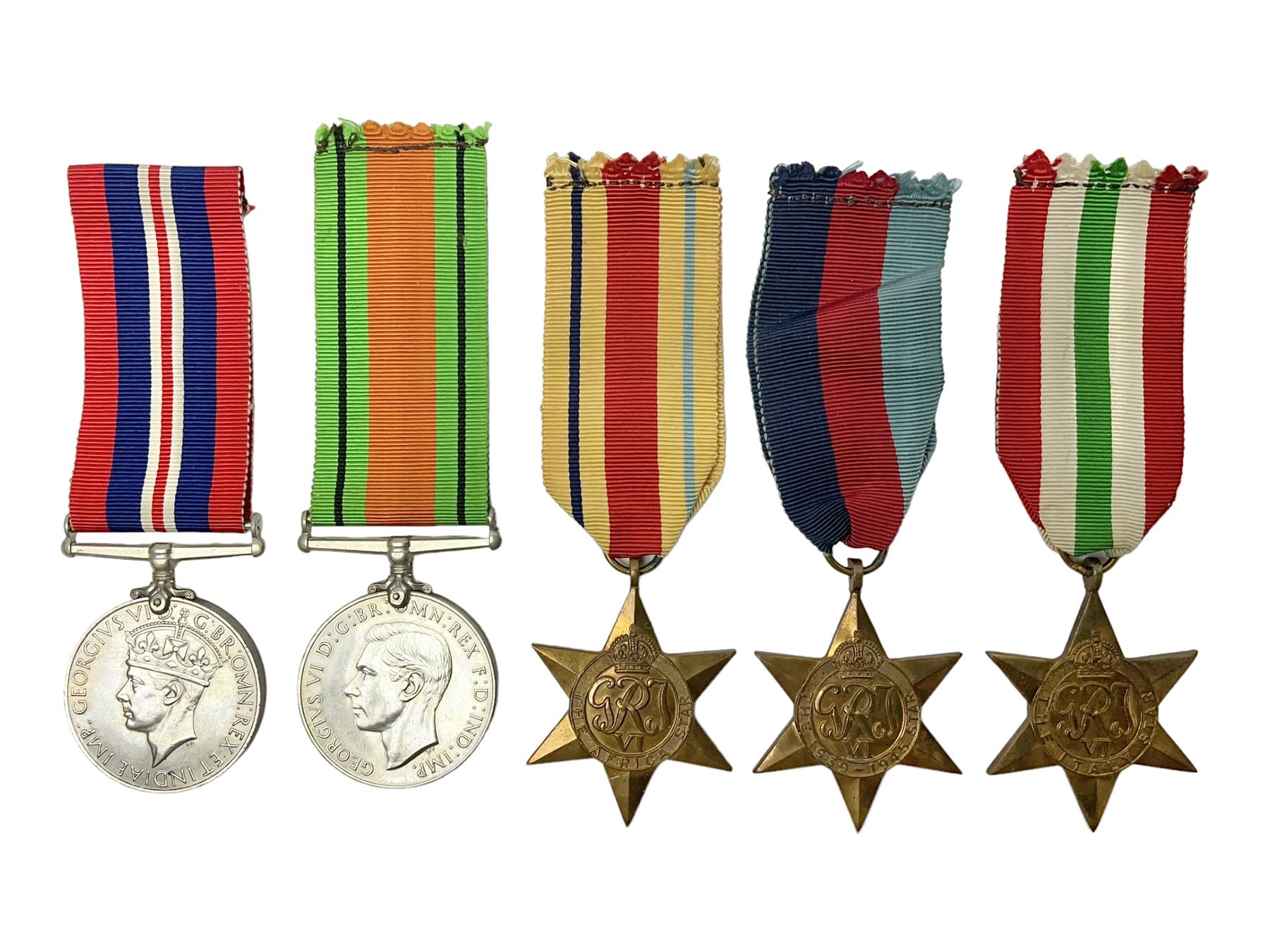 Group of five WWII medals comprising 1939-45 War Medal, Defence Medal and Italy, Africa and 1939-45 Stars; all with ribbons (5)