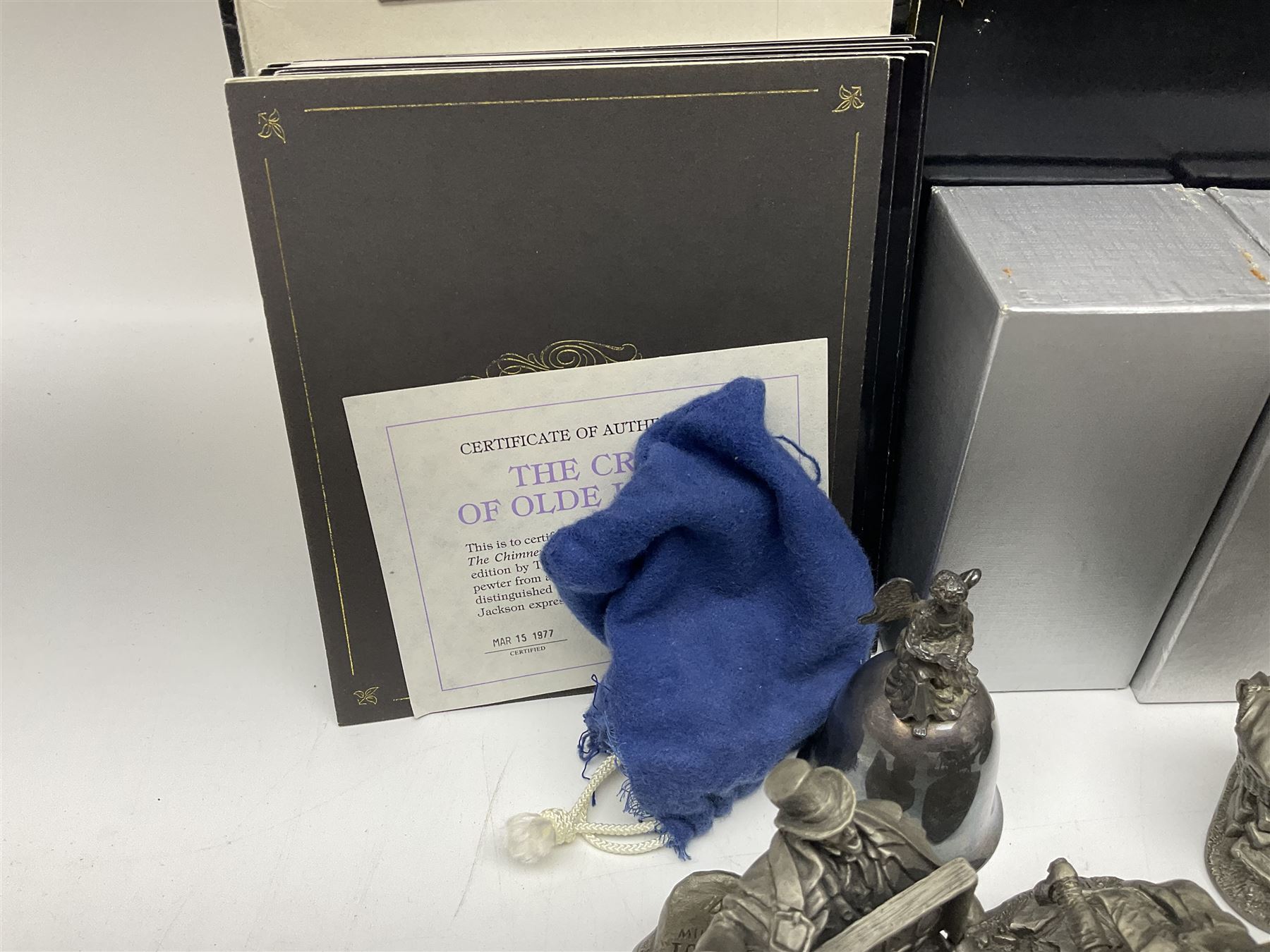 Twelve Franklin Mint pewter figures, to include some from the Cries of London series, together with a Franklin Mint 1937 Rolls Royce Phantom III pewter model and Danbury Mint Christmas bells