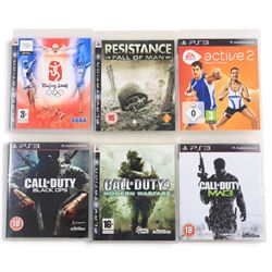Playstation 3 console with controller and power cable and ten games, comprising EA Sports Active 2 Personal Trainer, F1 Championship Edition, Tiger Woods PGA Tour 08, Call of Duty Black Ops, Call of Duty Modern Warfare, Call of Duty MW3, Resistance Fall of Man, Assassin's Creed, Fight Night Round 3, Beijing 2008